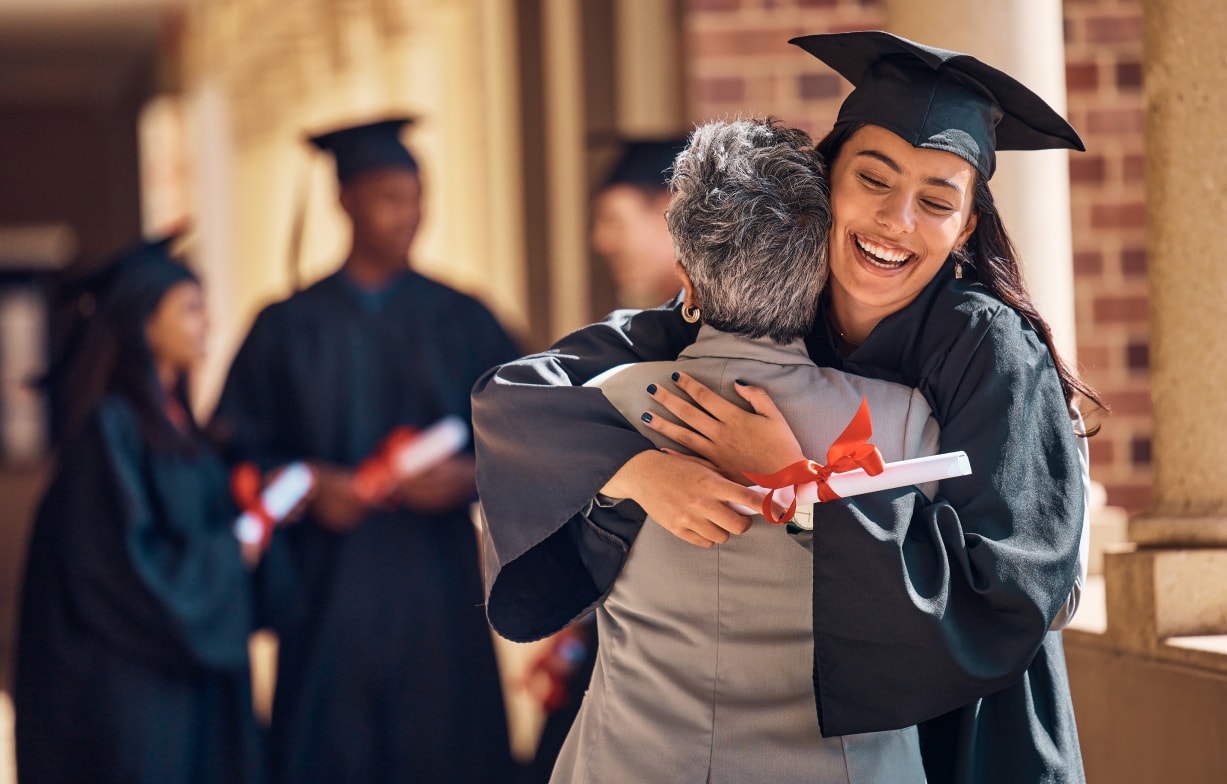 Hug, graduation and graduate, women and education achievement, success on university campus and certificate with academic goals reached